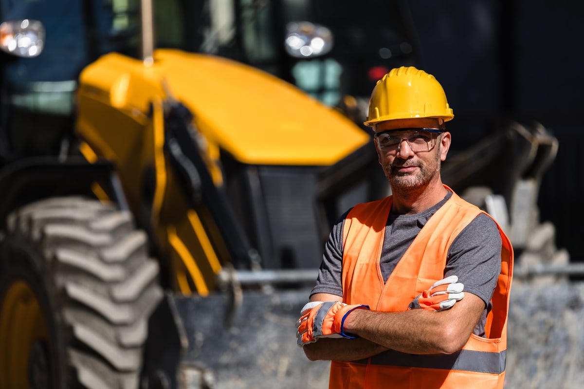 Construction worker in hard hat at site